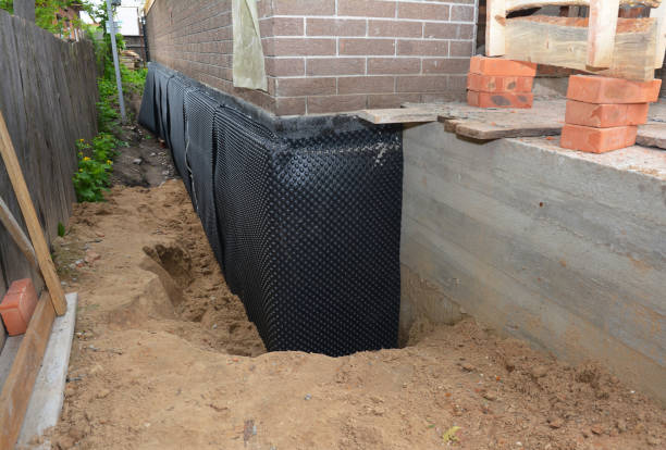 Happy homeowners after waterproofing job in Shelby